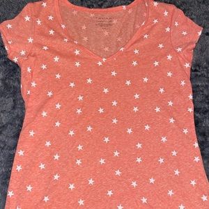 Small, pink stared t-shirt